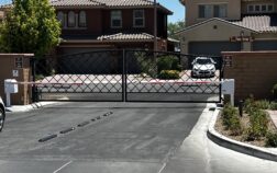 Double iron gate in the commercial facility with two LiftMaster gate operators into LiftMaster barrier arm gate operators in the Las Vegas community by battle born access
